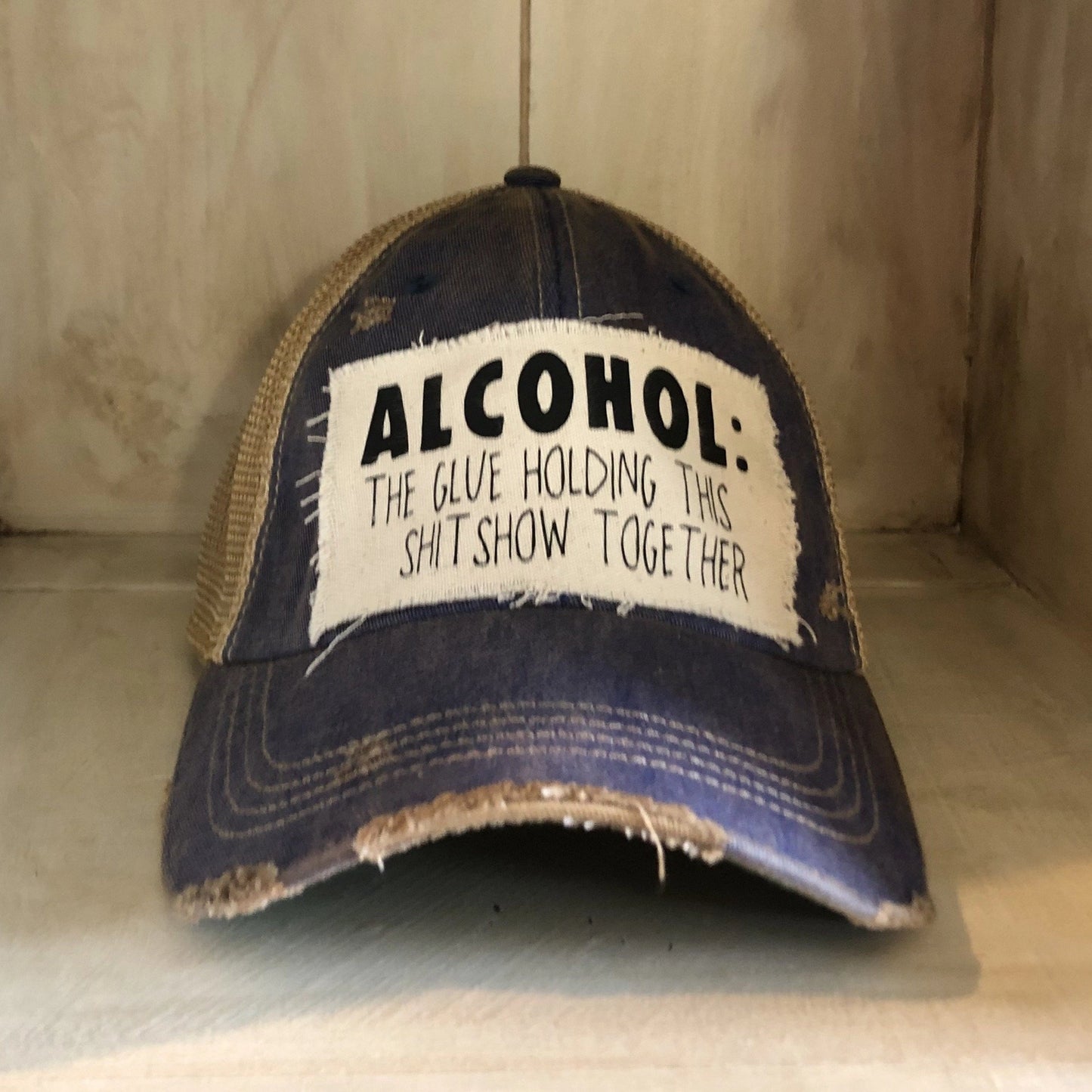 "Alcohol The Glue Holding This Shit Show Together" Hat in Black